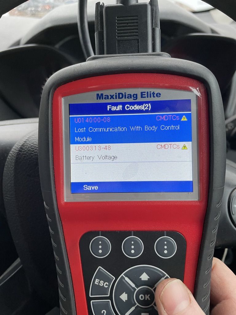 Scanner showing a battery voltage fault code stored together with a lost communication code on a van