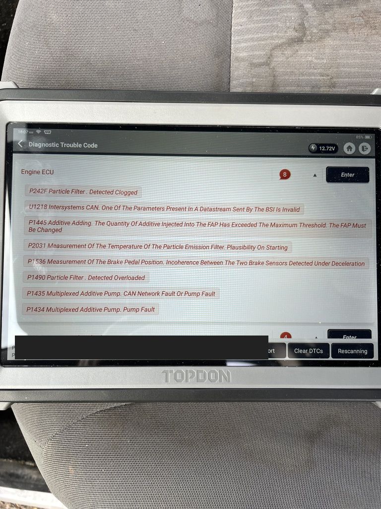 TOPDON scan of a 2013 Peugeot Partner showing P242F particle filter clogged with FAP additive fault codes