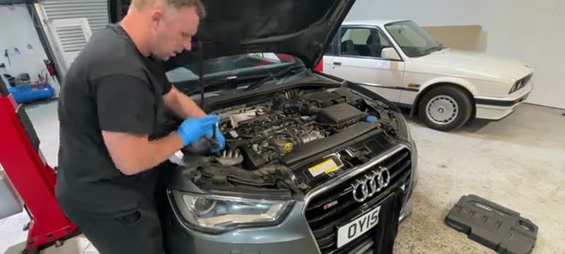 Removing the fuel filter and expansion bottle for access on the Audi A3 1.6 TDI