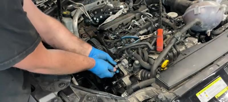 Fitting the new idler pulleys and tensioner on the Audi A3 1.6 TDI