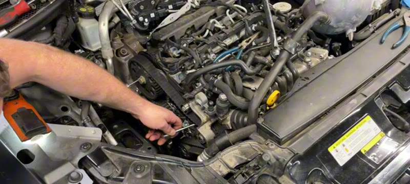 Rechecking the timing marks after turning the Audi A3 engine over twice