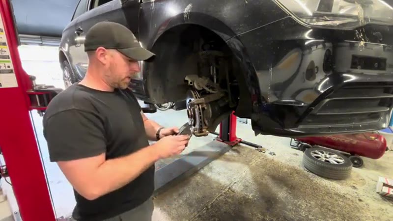 Applying a small amount of copper grease to the new Audi brake pads