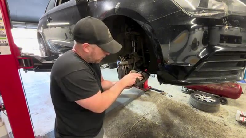 Fitting the new brake pads into the Audi caliper carrier