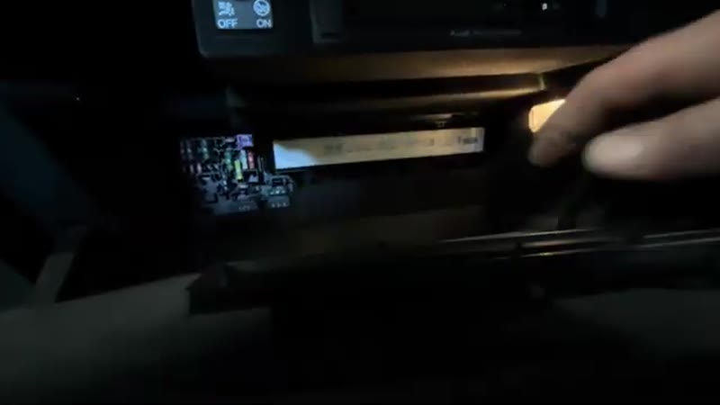 The Audi Q3 pollen filter housing opened behind the glove box with the filter visible