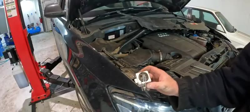 Holding the old D3S xenon bulb removed from the Audi Q5 headlight