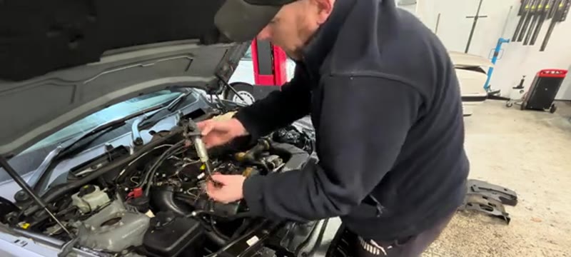 Pulling a pencil coil pack out of the BMW 335i cylinder head