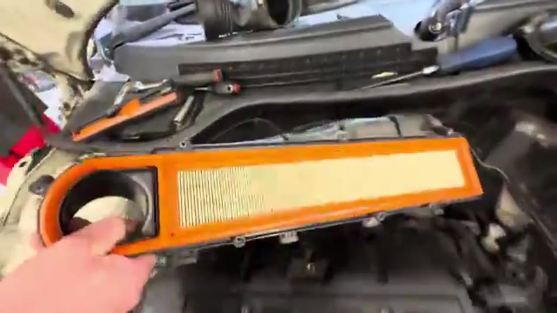 Removing the front airbox section and air filter from the Mini Cooper engine bay