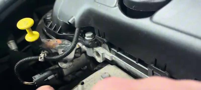 The exhaust Vanos solenoid with its two-pin plug on the BMW Mini cylinder head