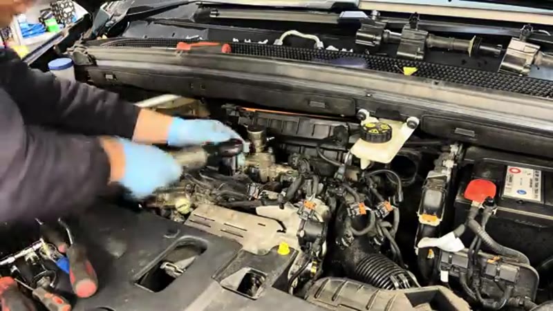 Stripping the boost pipe, coils and wiring from the top of the Citroen C4 PureTech engine