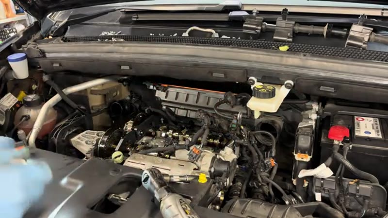 Fitting the flywheel locking pin from underneath the Citroen C4