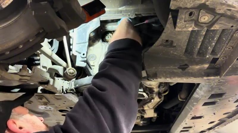 Removing the front cover to reach the wet belt tensioner and idler