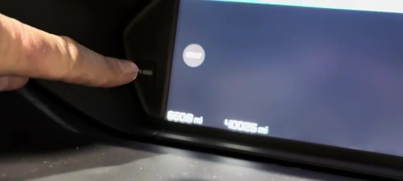 Pressing and holding the reset button next to the Citroen C4 instrument cluster