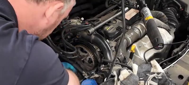 Torquing the new water pump bolts to spec on the Ford Focus