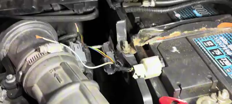 The DPF pressure sensor plug reconnected in the Ford Focus ST engine bay