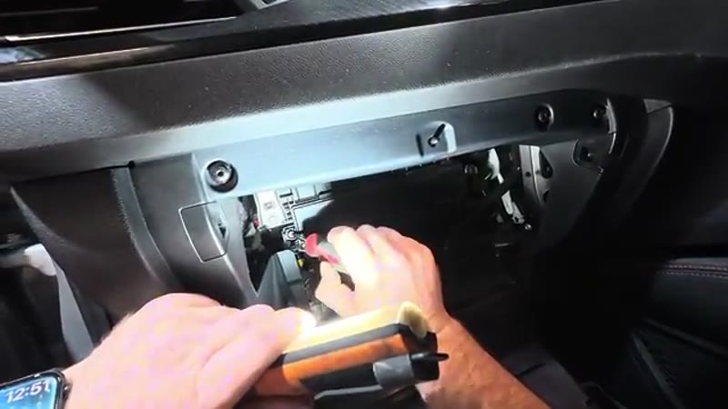Refitting the Torx screws and filter cover before clipping the Ford Kuga glove box back up