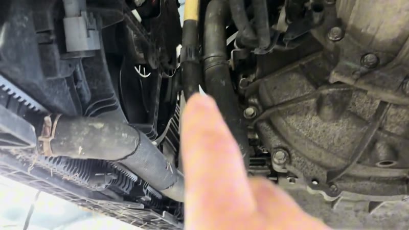 Plug and lower shield fixings underneath the Ford Puma radiator pack