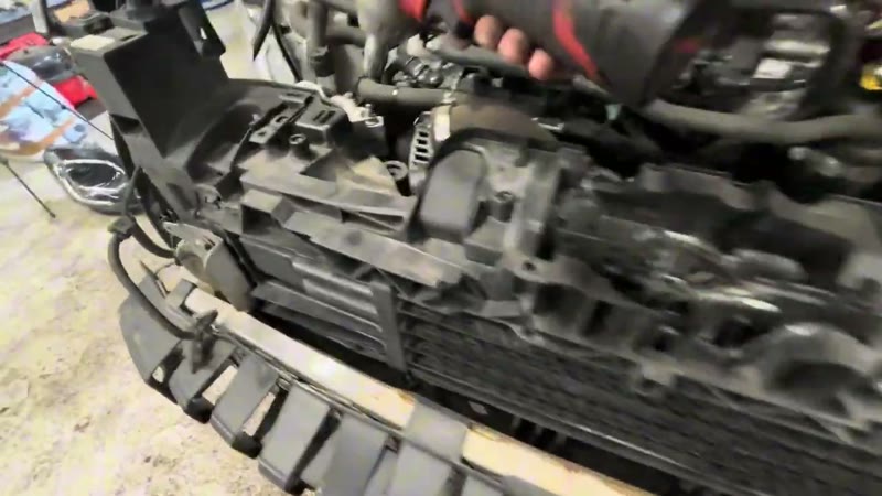 Disconnecting the top hoses and boost pipe on the Ford Puma radiator pack