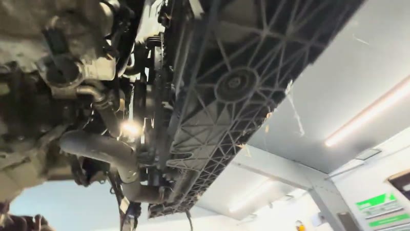 Lower hose and connections on the underside of the Ford Puma radiator pack