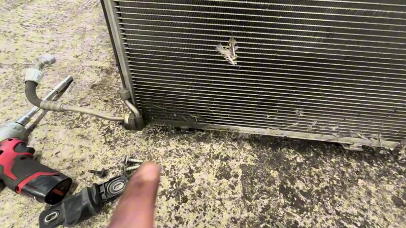 Strike damage visible in the middle of the Ford Puma air con condenser fins