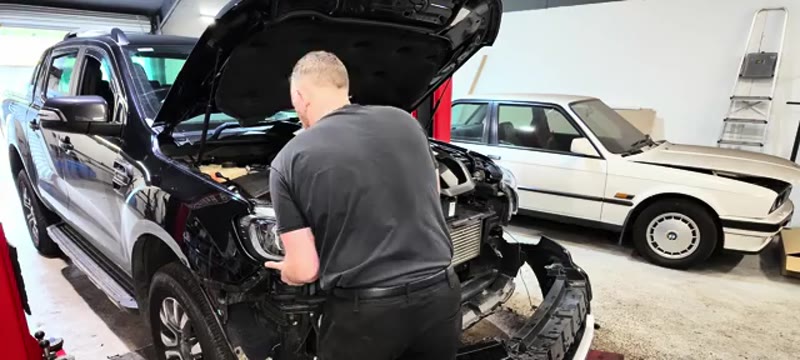 Fitting the new headlight into position on the 2021 Ford Ranger