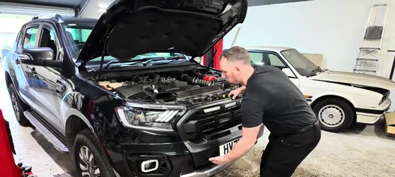 Pulling the grille forward to pop its clips out on the 2021 Ford Ranger