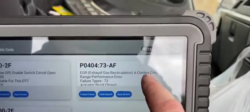 Diagnostic tablet showing the P0404 EGR fault code being cleared after the repair