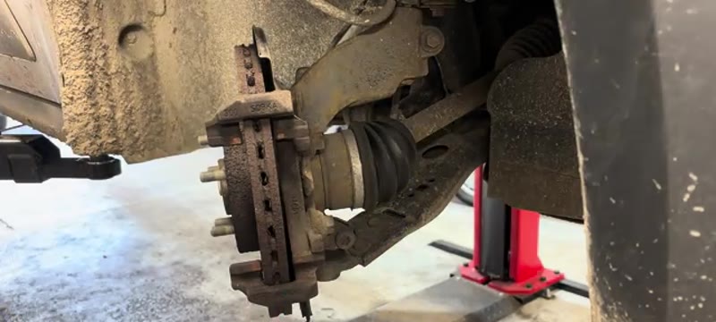 Brake pads and caliper carrier exposed ready for the two 18mm carrier bolts to come out