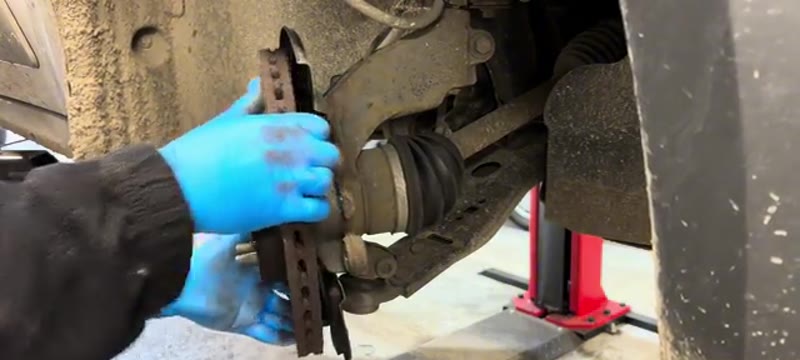 Easing the old brake disc off the hub of the Transit Connect