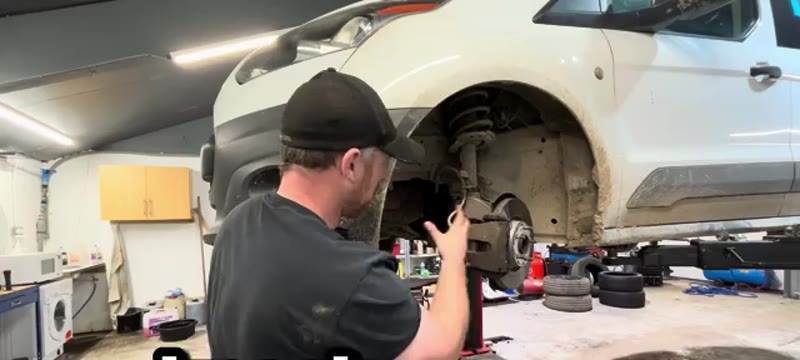 Fitting the inner end of the new driveshaft into the gearbox