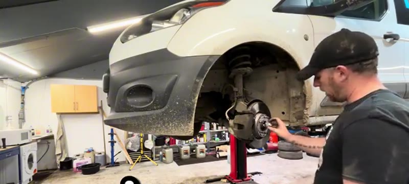 Sliding the outer splined end of the new driveshaft through the hub