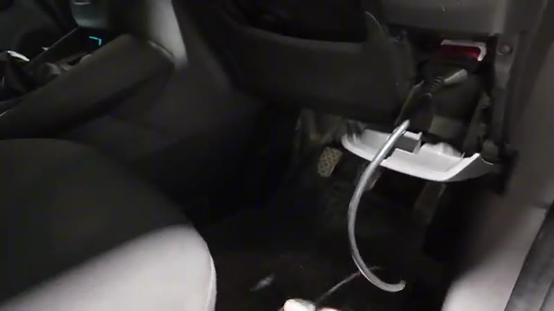 OBD scanner lead plugged into the port under the Ford Transit Connect dashboard showing no power