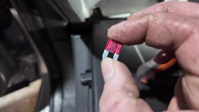 Fitting a new 10 amp micro fuse into position 19