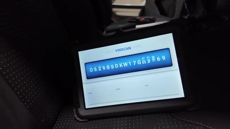 OBD scanner connected and communicating with the ECU after the fuse replacement