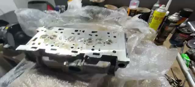 The rebuilt cylinder head back from the machine shop with new valves lapped in