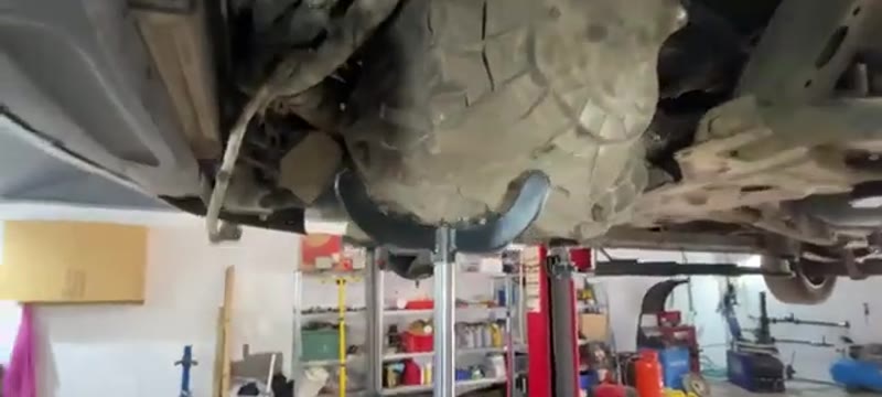 Lifting the gearbox back up into position under the van