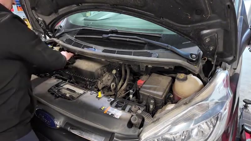 Removing the airbox and intake pipework from the engine bay of a Ford Transit Custom