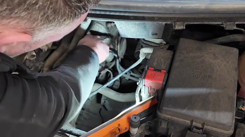 Disconnecting the vacuum pipes from the top of the vacuum pump on the Ford Transit Custom