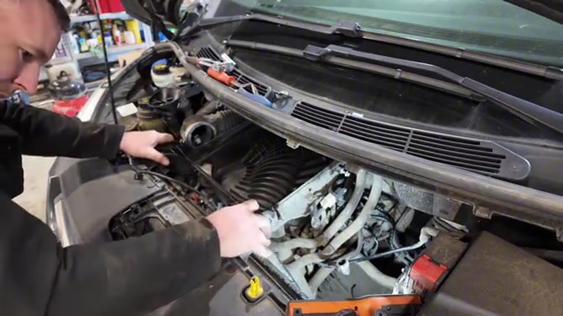 Refitting the airbox into the Ford Transit Custom engine bay before testing the vacuum