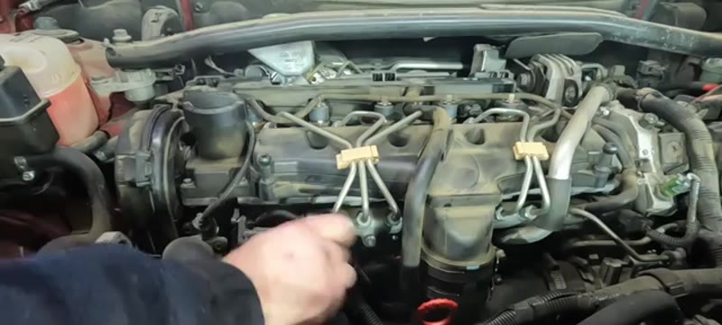 Refitting the glow plugs by hand into the cylinder head before reconnecting the wiring