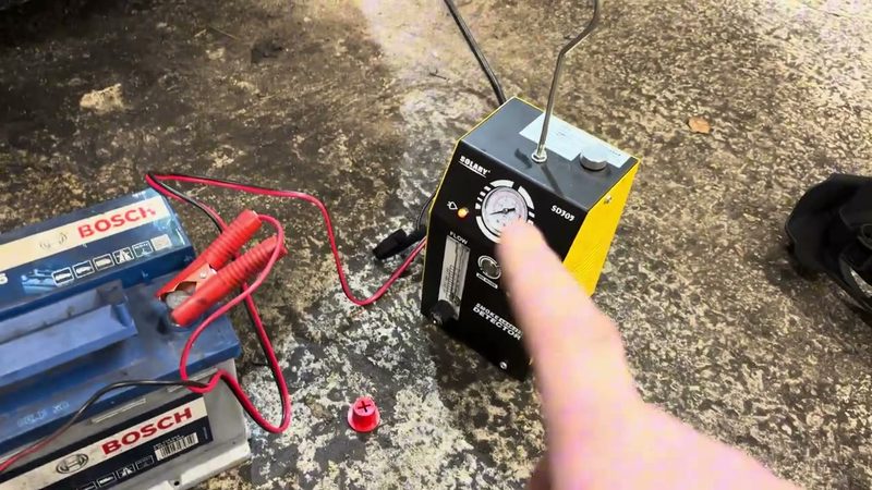 Smoke machine connected to the battery ready to test the Audi A3