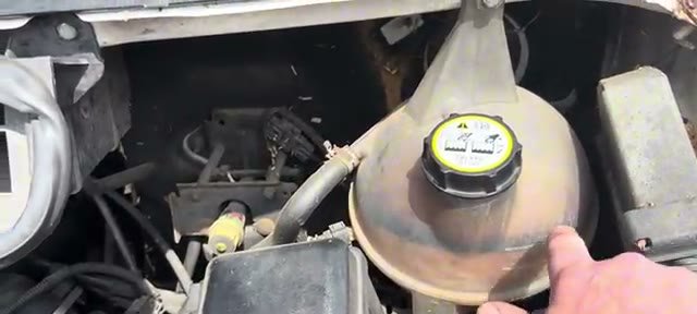 Black staining line inside the Ford Transit coolant bottle from exhaust gases