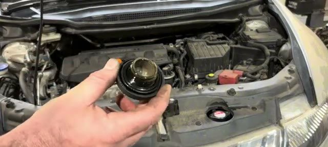 Slightly milky residue on the underside of the Honda Civic oil filler cap