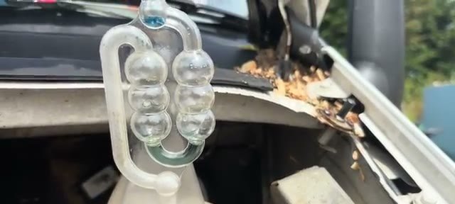 Comparing the original blue fluid in the reservoir against the green-turning fluid in the tester trap