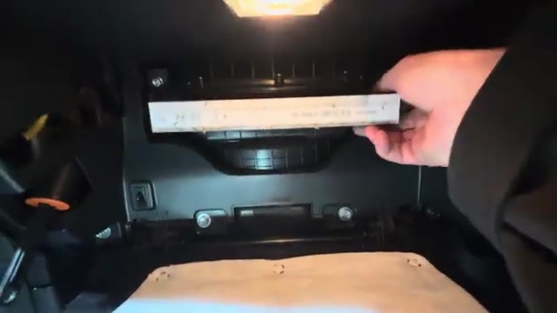 Sliding the dirty old pollen filter out of its housing