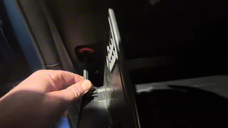 Refitting the glove box side clip and turning it to lock into position