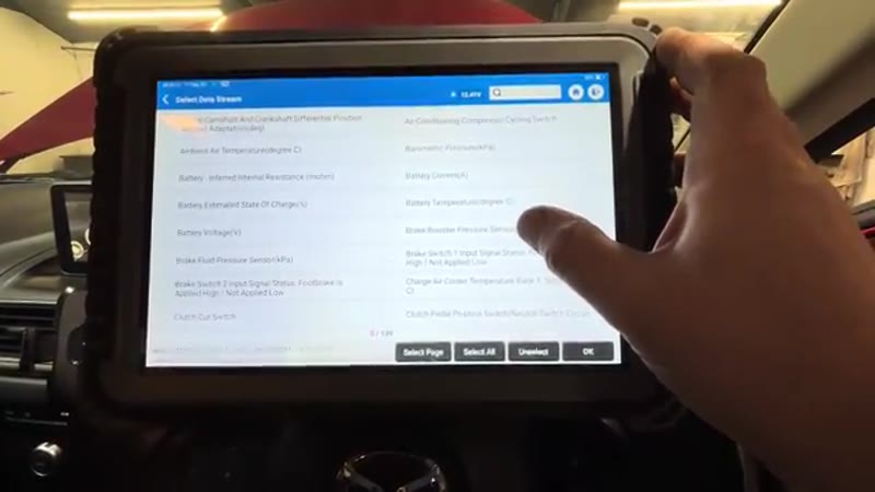 Diagnostic scanner showing the P258B fault code and brake booster pressure live data on a Mazda 3