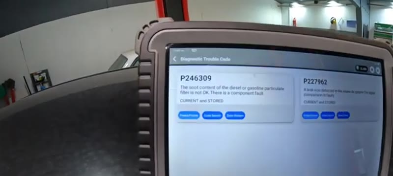 Diagnostic scanner showing DPF and air intake leak fault codes on a Mercedes C220 CDI