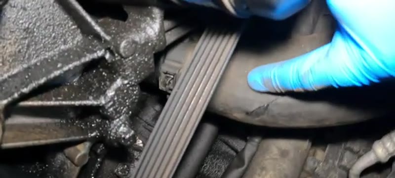Close-up of the split boost pipe coated in oil on a Mercedes C220 CDI