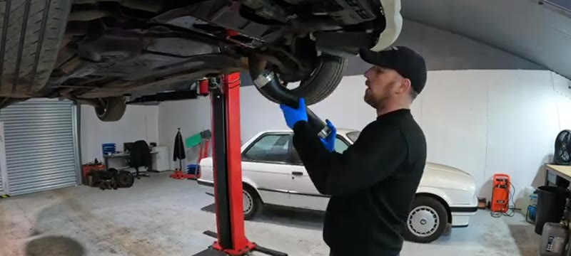 Fitting the new boost pipe from underneath the raised Mercedes C220