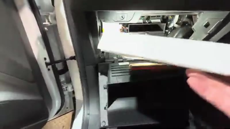 Sliding the old pollen filter out of the housing on a 2021 MG ZS